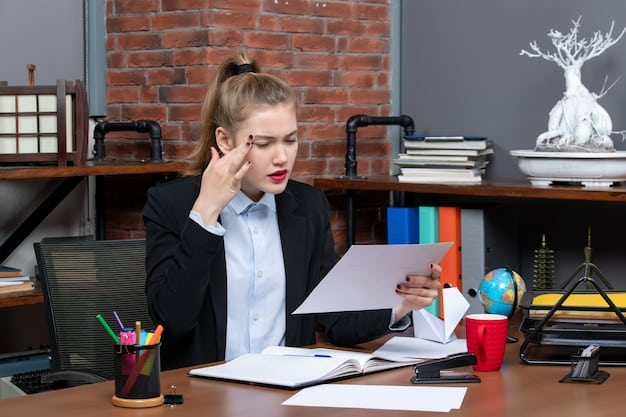 A frustrated manager sitting at their desk, surrounded by paperwork and looking stressed, symbolizing the burden and administrative overhead associated with high employee turnover. The image is in a corporate office setting.