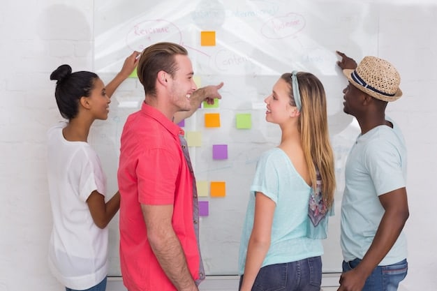 Three colleagues in a bright, modern office, standing around a whiteboard covered in colorful sticky notes and diagrams. They are pointing to different sections, seemingly brainstorming and coordinating tasks.
