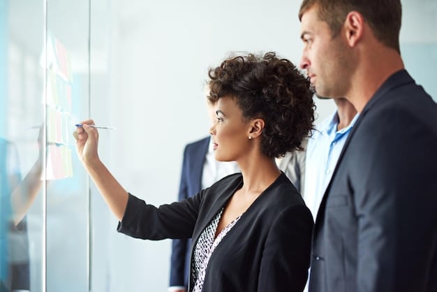 Two business partners reviewing a roadmap on a whiteboard in a modern office. They are pointing at different milestones, indicating a discussion about future goals and strategies.