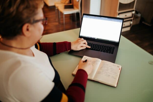 A person sitting at a desk, researching grant opportunities on a laptop. The screen shows a grant database, and the person is taking notes. The image emphasizes the research and planning involved in finding the right grant.