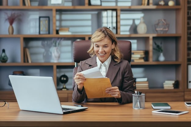 A business owner sitting at a desk, reviewing documents and typing on a laptop, with a focus on the determination and preparation required for successfully applying for an SBA loan.