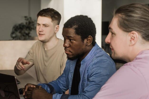 A diverse group of startup employees attending an engaging data privacy training session, looking attentive and taking notes.