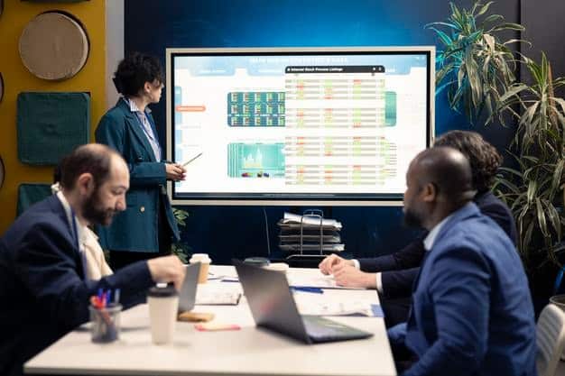 A diverse team of professionals in a modern office collaborating on a large digital screen displaying complex flowcharts and compliance checklists, emphasizing teamwork and strategic planning.