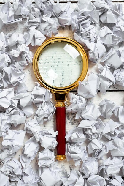 A magnifying glass hovering over complex legal documents and a 