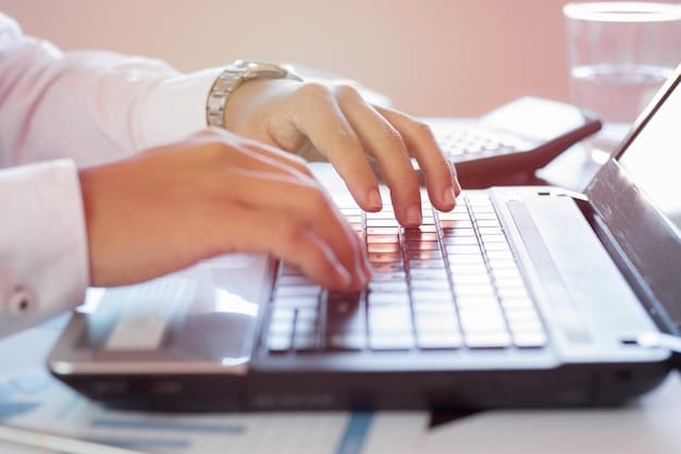 A close-up shot of a hand entering data into a tax software on a laptop. The soft, focused background shows office elements, highlighting the need for accurate record-keeping for tax compliance for startups.