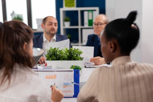A startup CEO and environmental consultant reviewing environmental permit documentation at a conference table. The documents include detailed information on EPA regulations, compliance standards, and permit requirements relating to waste management and air quality. They are in a meeting to ensure the company is meeting all of its requirements for Environmental Compliance for Startups: Understanding EPA Regulations and Avoiding Violations.
