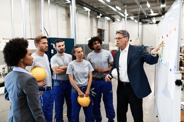 A group of startup employees participating in a workplace safety training session. The instructor is demonstrating the proper use of safety equipment. The scene highlights the importance of training in achieving Workplace Safety Compliance.